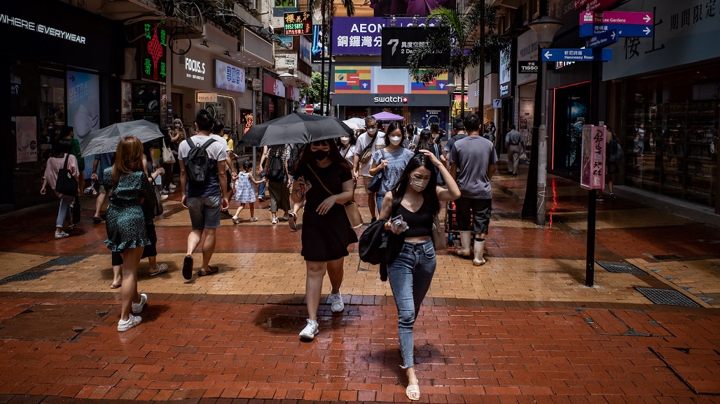 HONG KONG, CHINA - AUGUST 06: Pedestrians walk at a shopping district on August 06, 2022 in Hong Kong, China. Hong Kong's economy contracted consecutively for the last two quarters in a row due to weak exports and investment as it struggles with pandemic-induced restrictions. (Photo by Anthony Kwan/Getty Images)